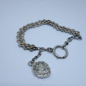 Chaîne de montre argent bicolore.