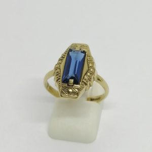 Bague en plaqué or avec pierre bleu.
