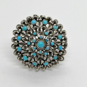 Broche/pendentif argent , ronde et ajourée, sertie de turquoises cabochons.