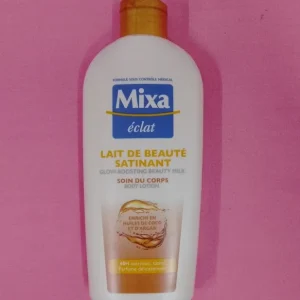 Lait de Beauté satinant MIXA ÉCLAT soin du corps enrichi en huiles de coco et d&rsquo;argan 230ml